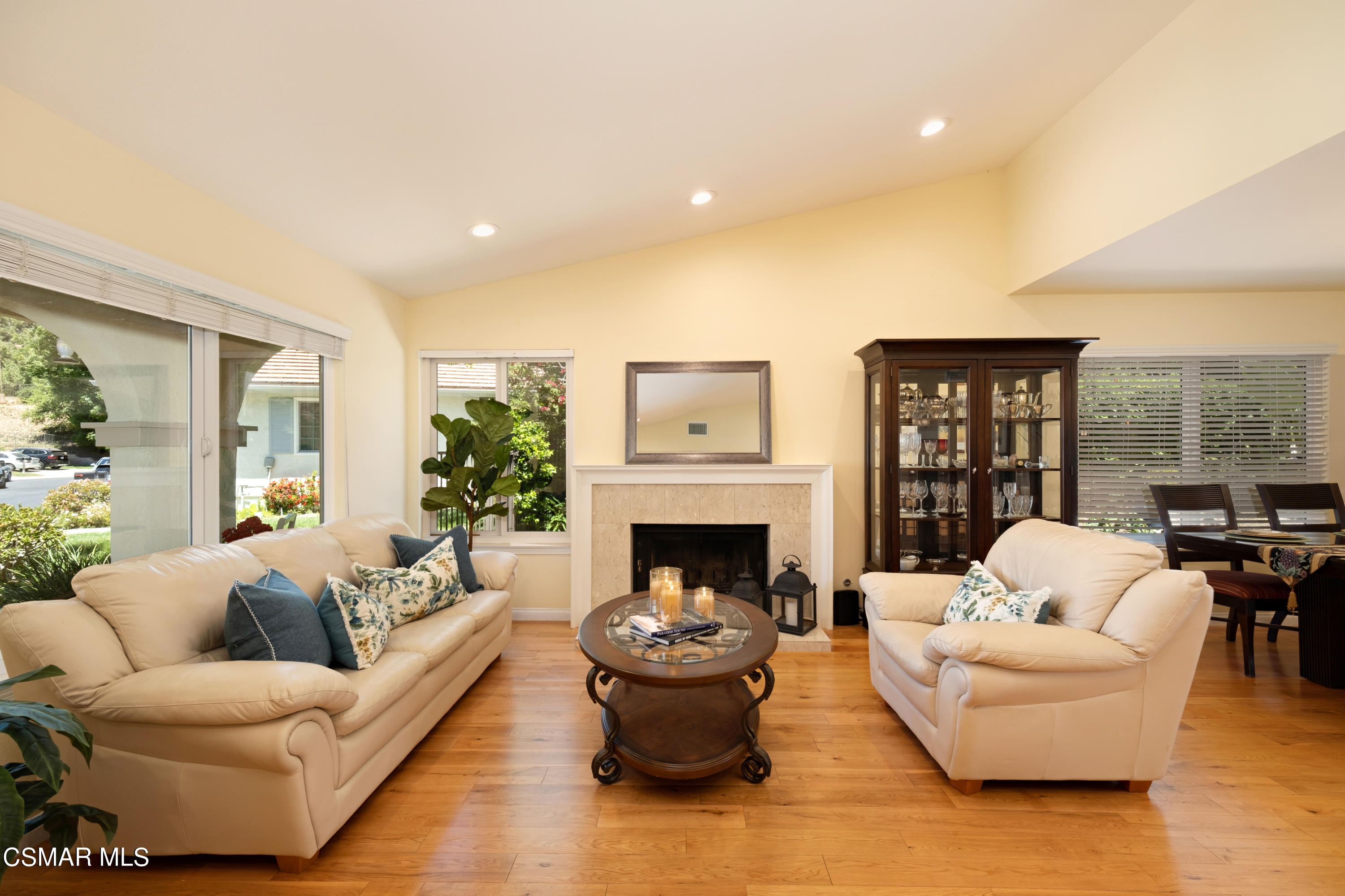 19358 Crystal Ridge Lane Porter Ranch, CA 91326 - Photo 7 of 37 a living room with furniture and a fireplace