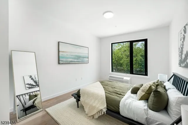 a bed room with a bed and a window