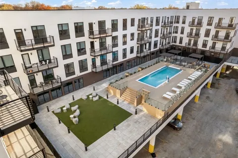 a view of a chairs and table in a patio