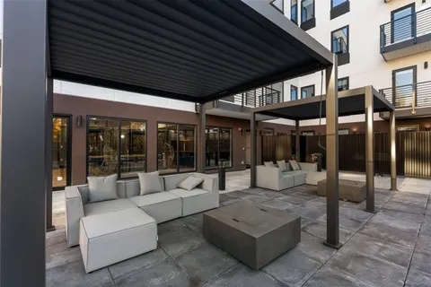 a patio with patio couch and table