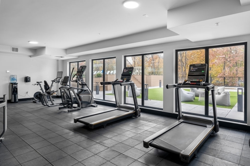 803 South Avenue, Unit 503 Plainfield, NJ 07062 - Photo 42 of 45 a room with gym equipment and floor to ceiling window
