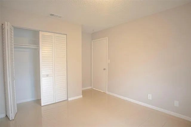 a view of a pathway both side of house