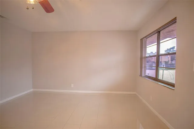a bathroom with a granite countertop toilet a sink and bathtub