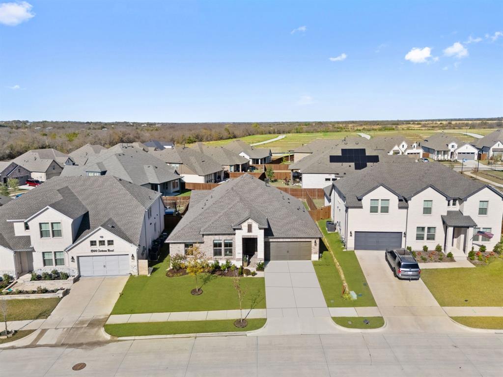 1340 Cartona Road Fate, TX 75087 - Photo 28 of 32 an aerial view of a house with a ocean view