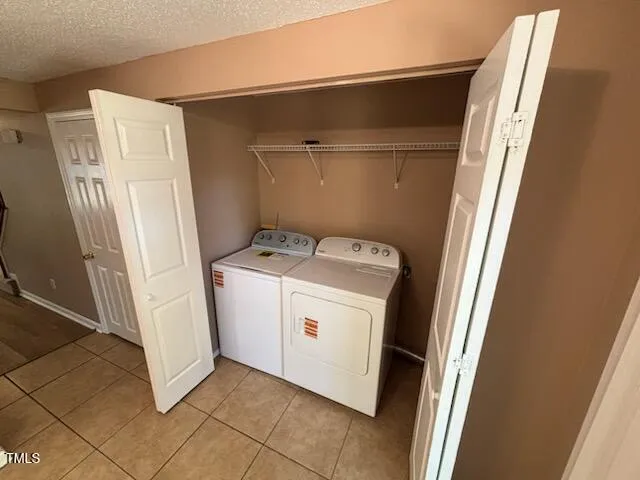 a kitchen with stainless steel appliances granite countertop a refrigerator sink and stove