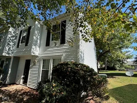 a view of a house with a tree