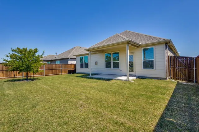a front view of a house with yard
