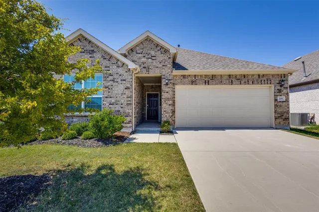 a front view of a building with garden