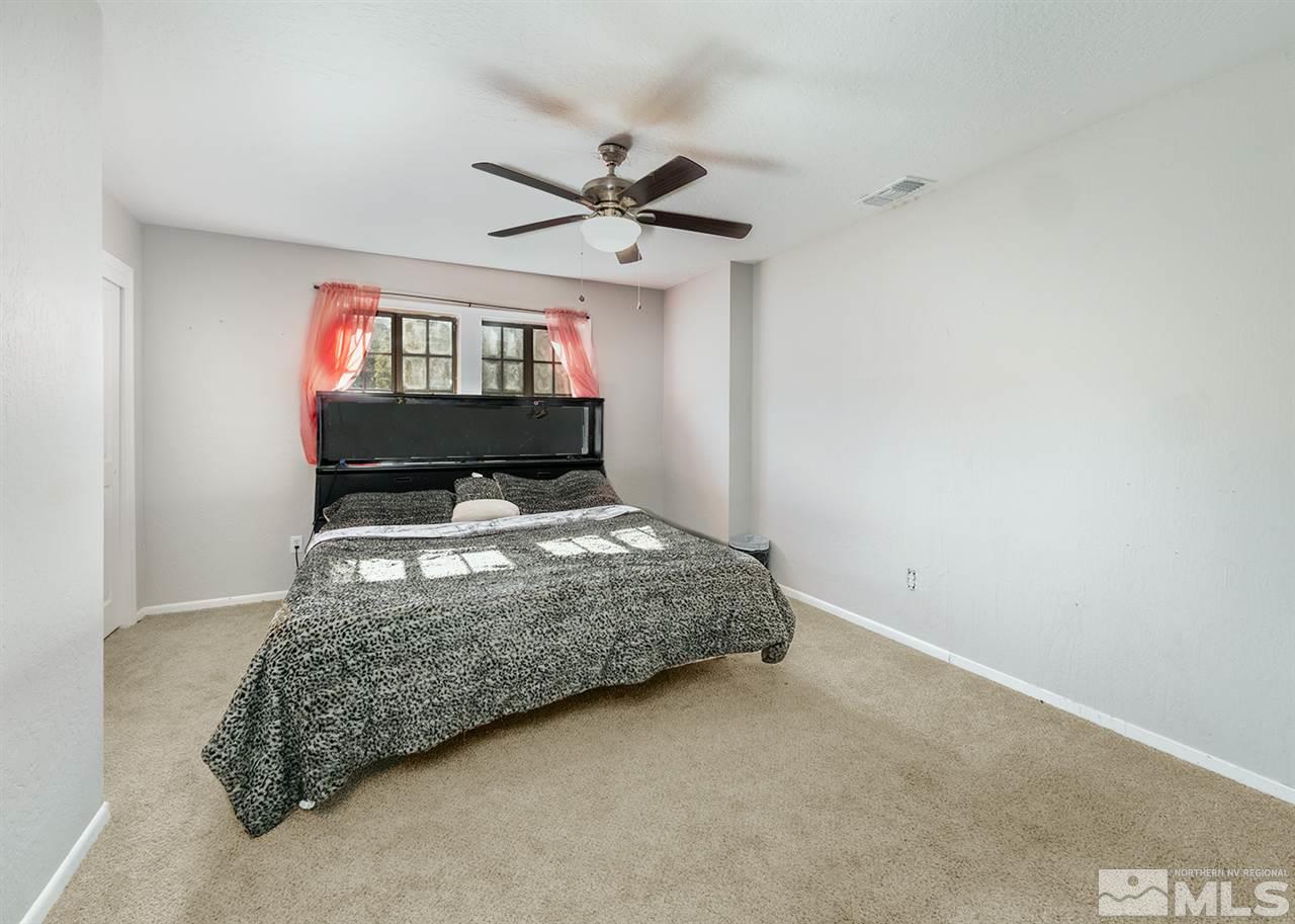 2220 Lousetown Road Reno, NV 89521 - Photo 8 of 22 a bedroom with a bed and window