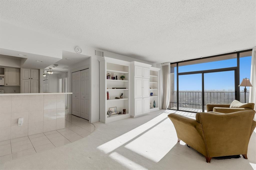 5200 Keller Springs Road, Unit 1315 Dallas, TX 75248 - Photo 2 of 40 a living room with furniture and a large window