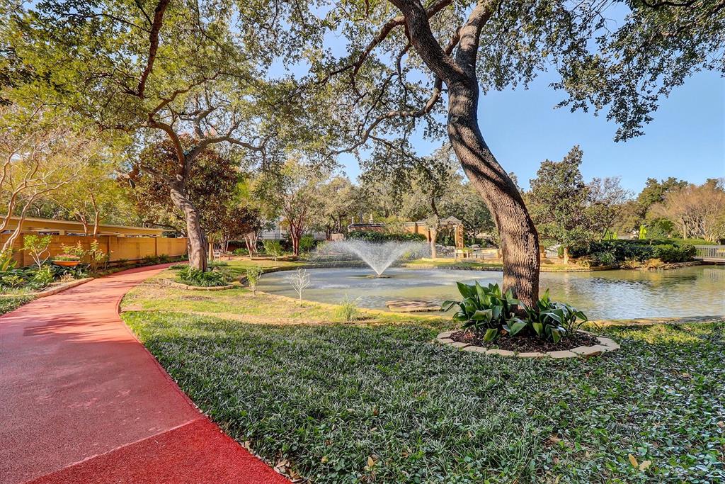 5200 Keller Springs Road, Unit 1315 Dallas, TX 75248 - Photo 31 of 40 a view of a fountain in front of a house