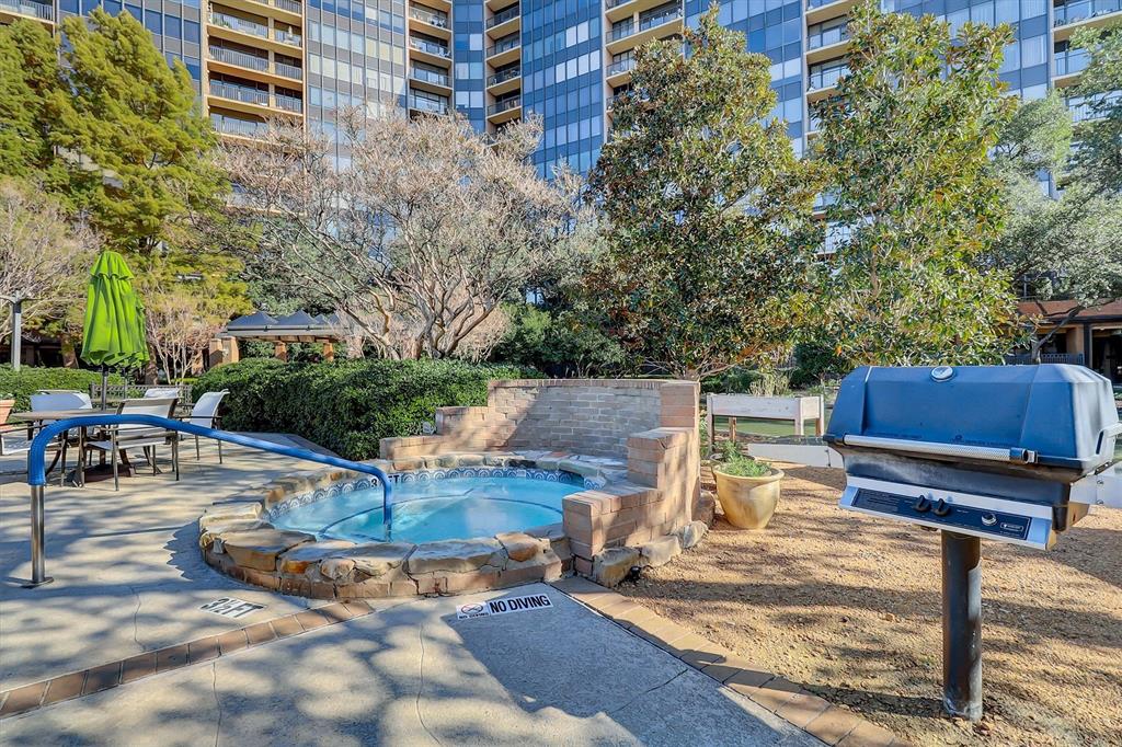 5200 Keller Springs Road, Unit 1315 Dallas, TX 75248 - Photo 35 of 40 a view of a swimming pool with chairs in patio