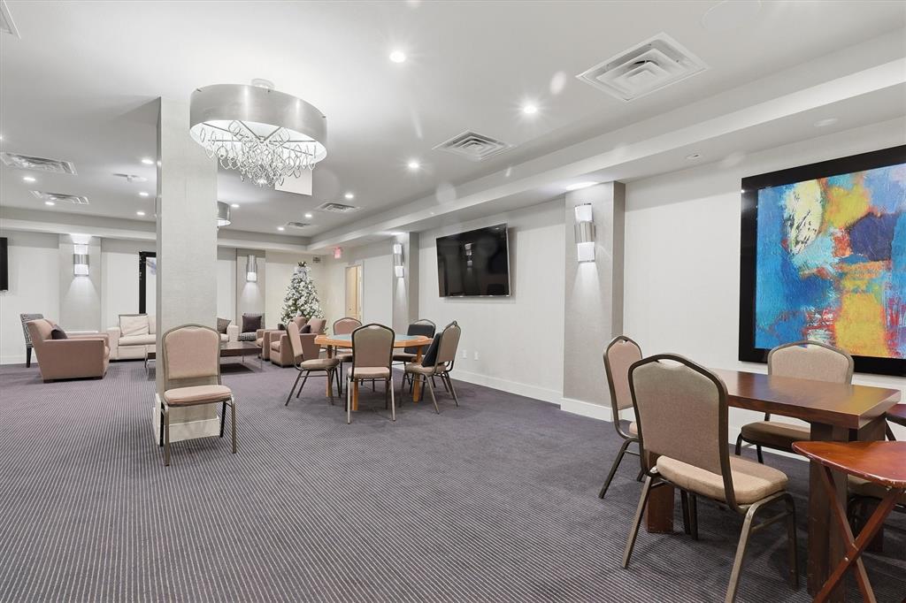 5200 Keller Springs Road, Unit 1315 Dallas, TX 75248 - Photo 37 of 40 a view of a livingroom with furniture and a large window