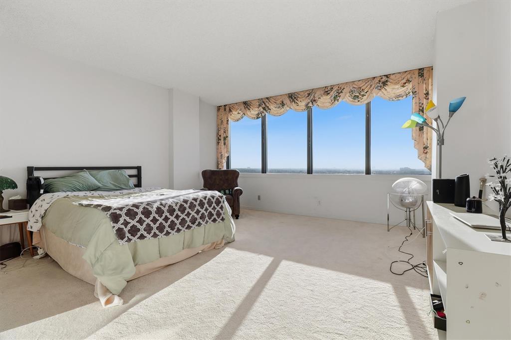 5200 Keller Springs Road, Unit 1315 Dallas, TX 75248 - Photo 9 of 40 a bedroom with a bed and a window