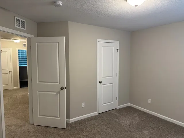 an empty room with closet