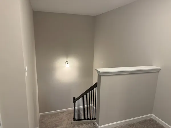 a view of staircase with wooden floor