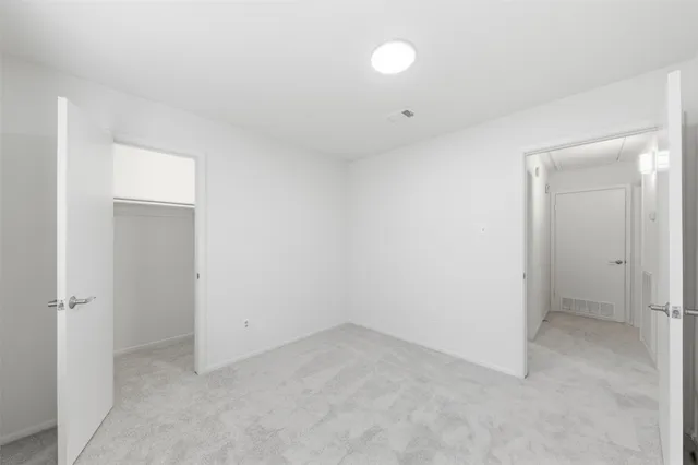 an empty room with a bathroom