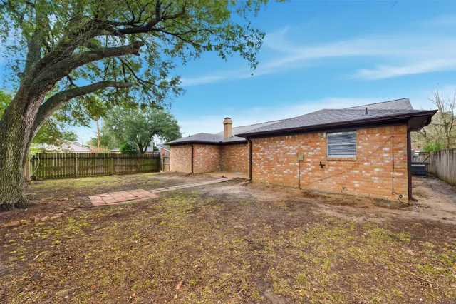 a view of backyard with outdoor space