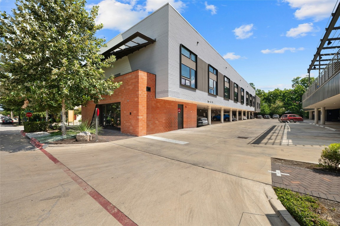 49 Navasota Street, Unit 216 Austin, TX 78702 - Photo 2 of 37 a front view of a building with street view
