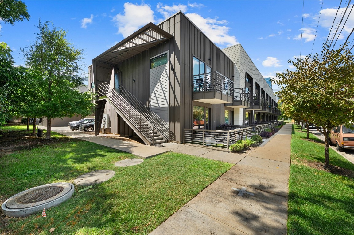 49 Navasota Street, Unit 216 Austin, TX 78702 - Photo 7 of 37 a view of a house with a yard
