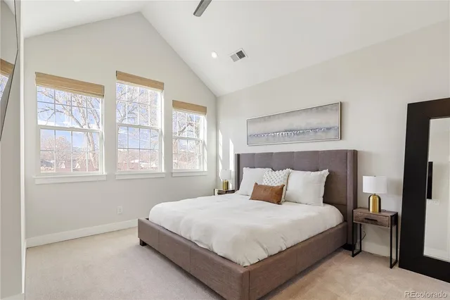 a bedroom with a bed and a television