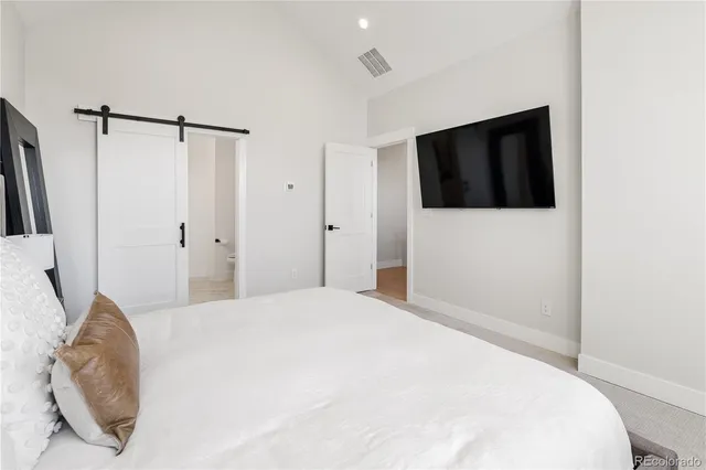 a bathroom with a tub sink and glass door