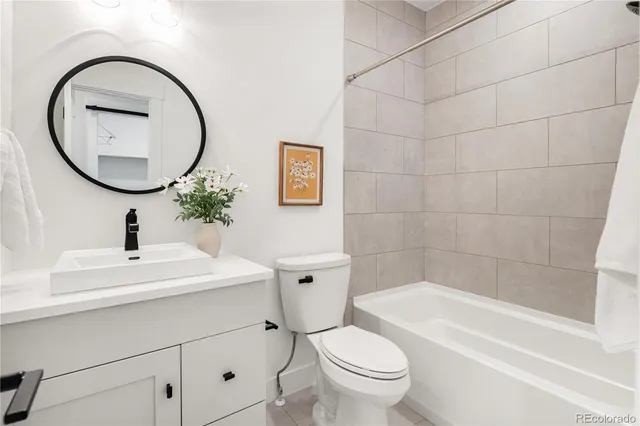 a view of a livingroom with furniture and a flat screen tv