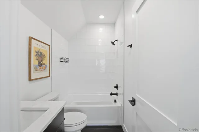 a front view of a house with a street