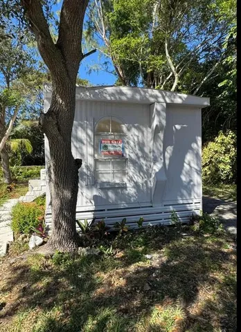 a kitchen with a refrigerator and a sink