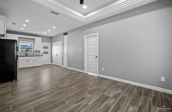 a view of a kitchen with a dishwasher and a refrigerator