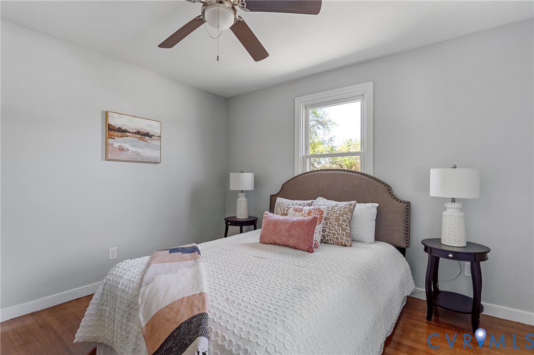 2700 Berry Road Richmond, VA 23234 - Photo 27 of 46 a bedroom with a bed and a lamp