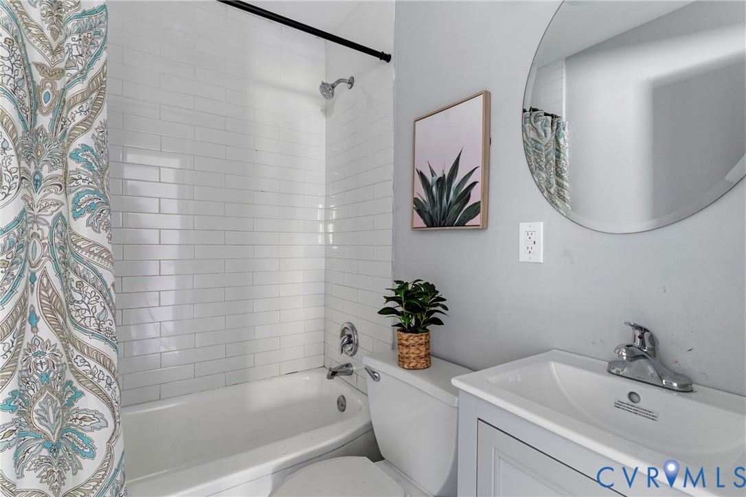 2700 Berry Road Richmond, VA 23234 - Photo 29 of 46 a bathroom with a sink and a mirror