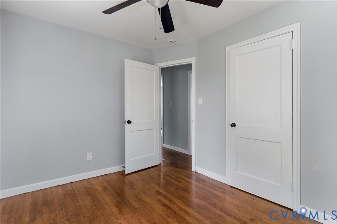 2700 Berry Road Richmond, VA 23234 - Photo 30 of 46 an empty room with wooden floor cabinet and windows