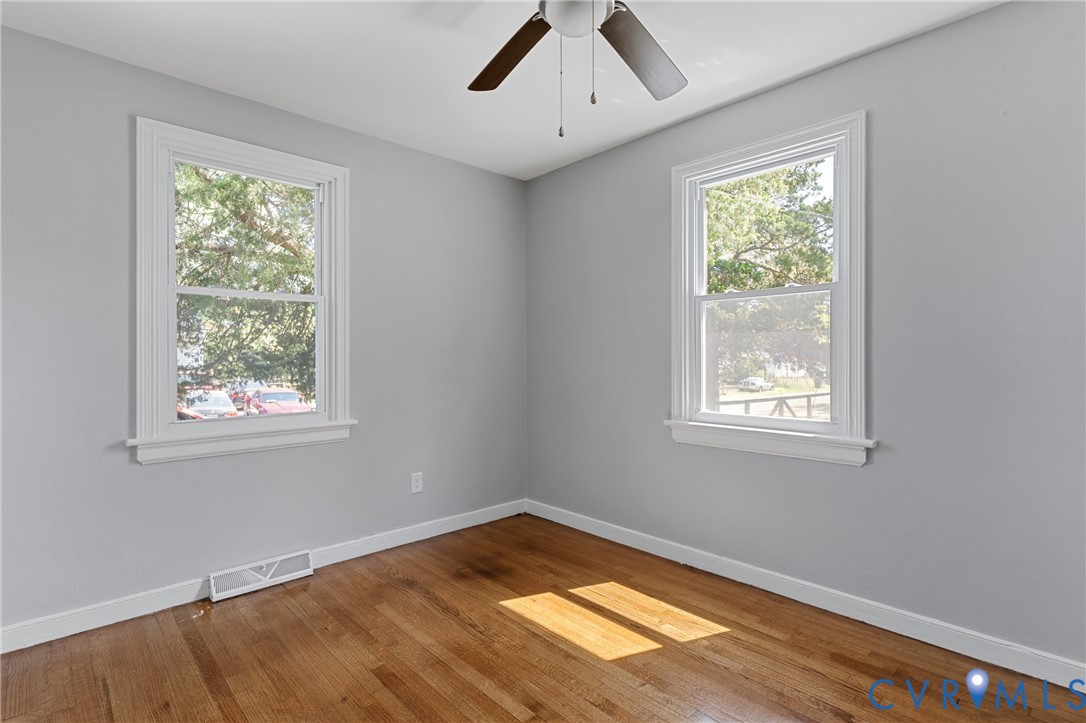 2700 Berry Road Richmond, VA 23234 - Photo 31 of 46 a view of empty room with wooden floor and fan