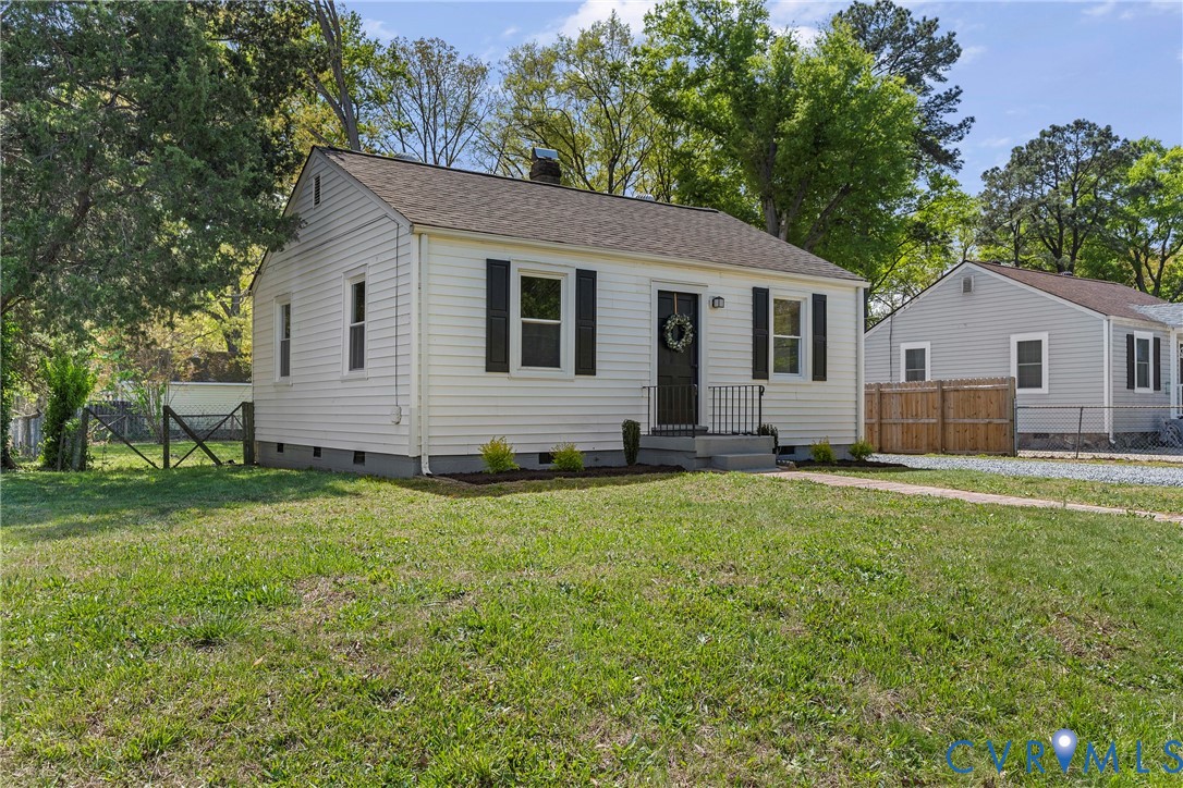 2700 Berry Road Richmond, VA 23234 - Photo 5 of 46 a front view of house with yard and trees