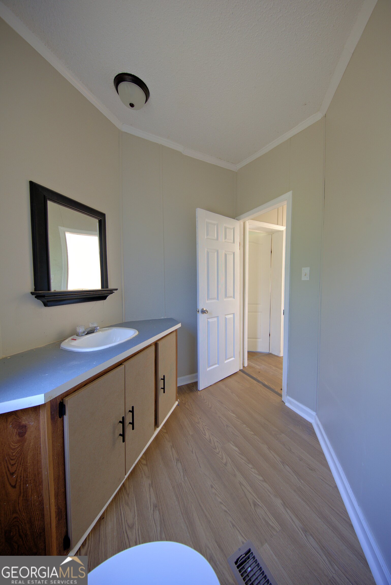 4702 Highway 65 Pelham, GA 31779 - Photo 14 of 21 a room with wooden floor and window