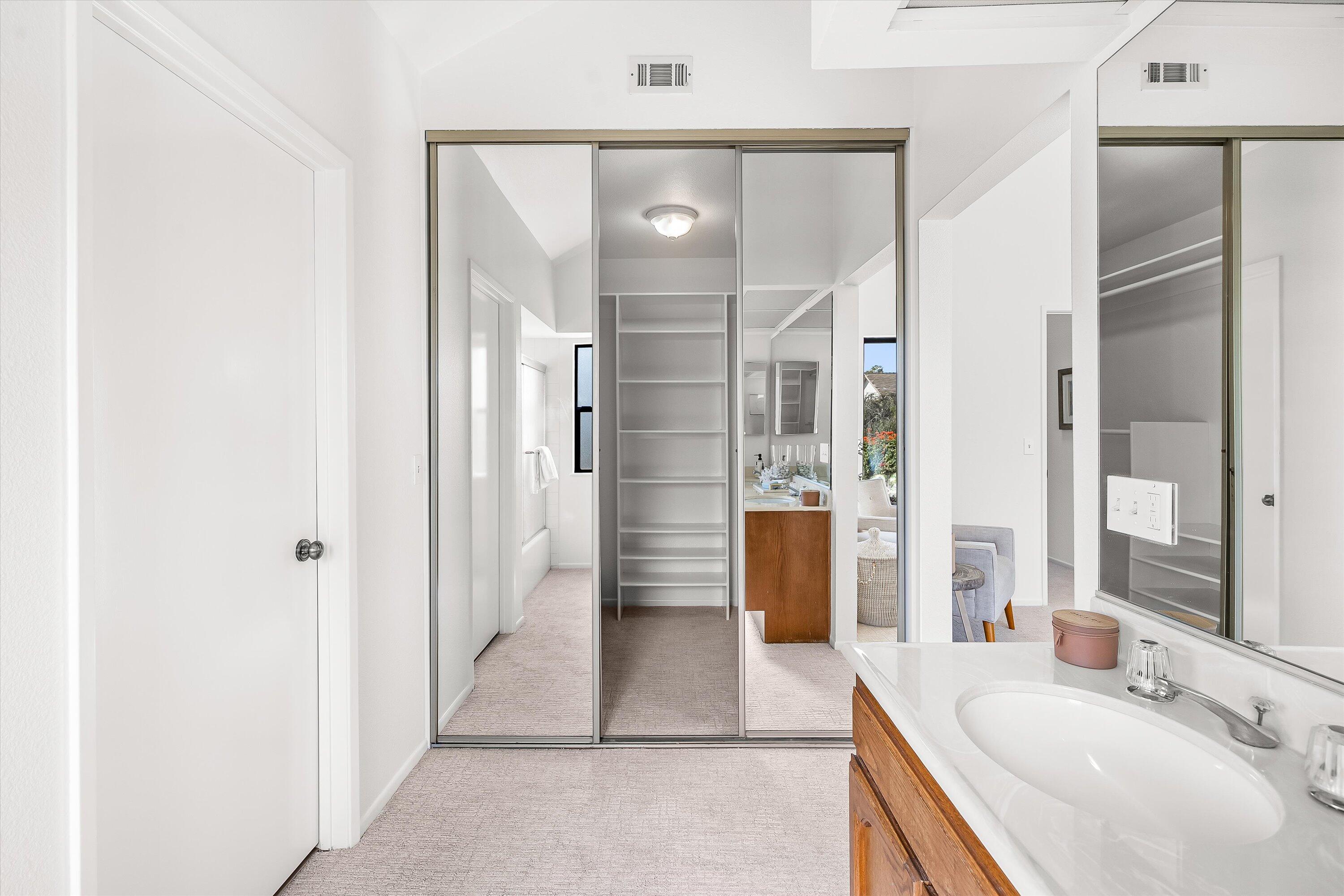 779 Dos Hermanos Road Santa Barbara, CA 93111 - Photo 16 of 33 a bathroom with a sink a shower and a mirror