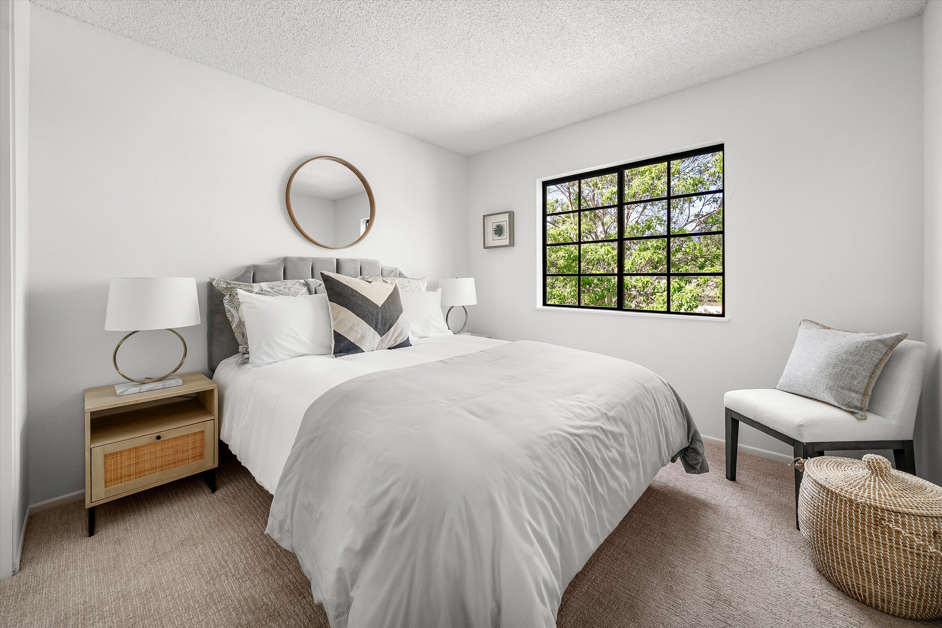 779 Dos Hermanos Road Santa Barbara, CA 93111 - Photo 19 of 33 a bedroom with bed and a large window