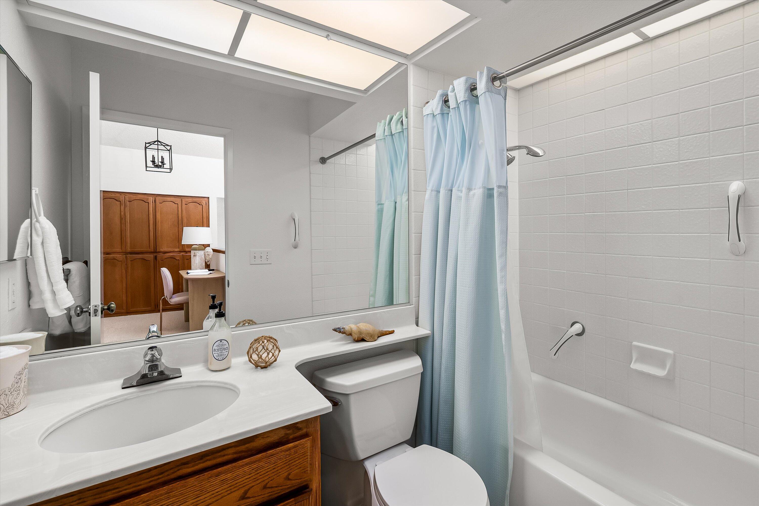 779 Dos Hermanos Road Santa Barbara, CA 93111 - Photo 20 of 33 a bathroom with a sink toilet tub and shower