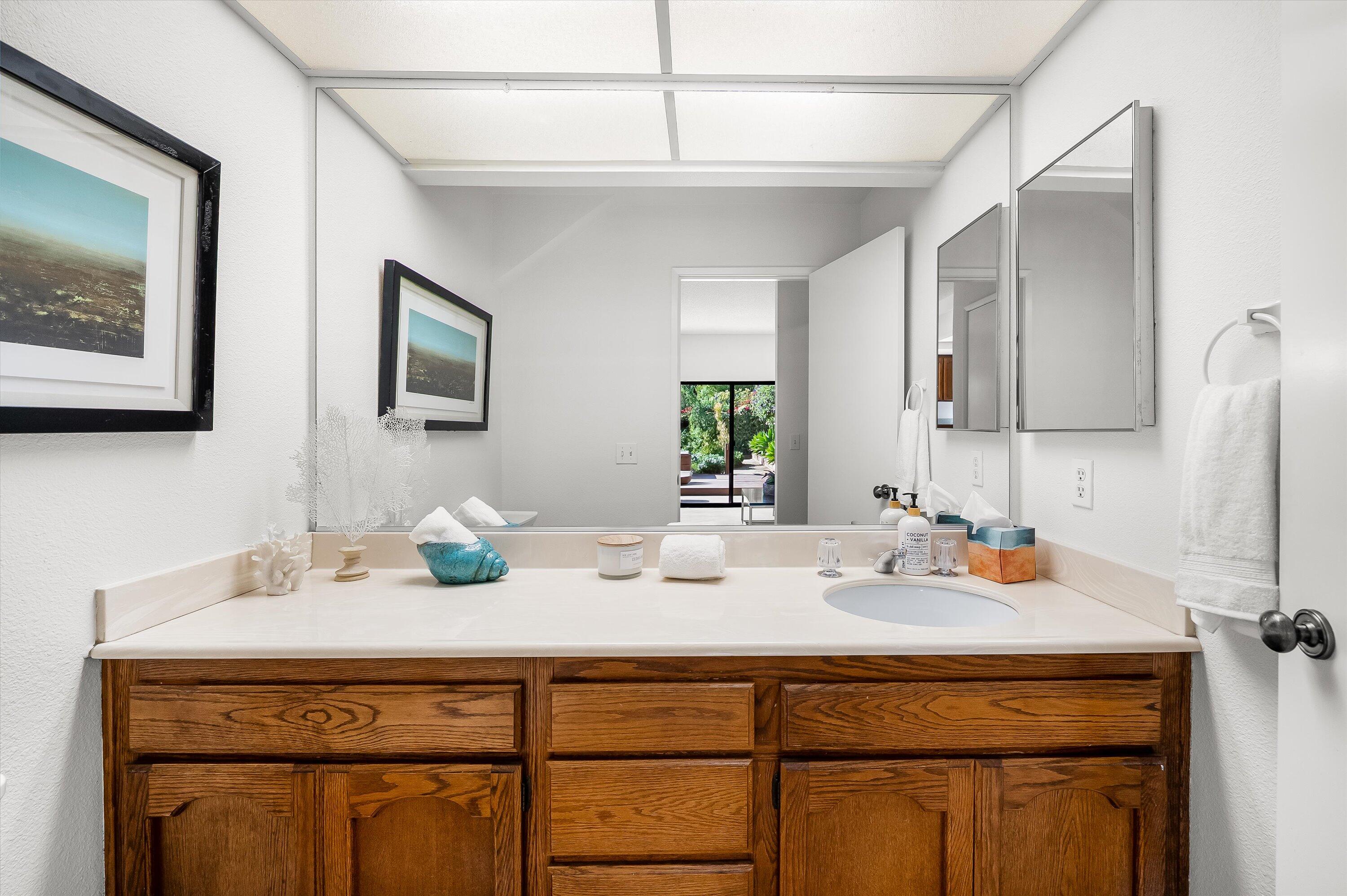779 Dos Hermanos Road Santa Barbara, CA 93111 - Photo 21 of 33 a bathroom with a sink and a mirror