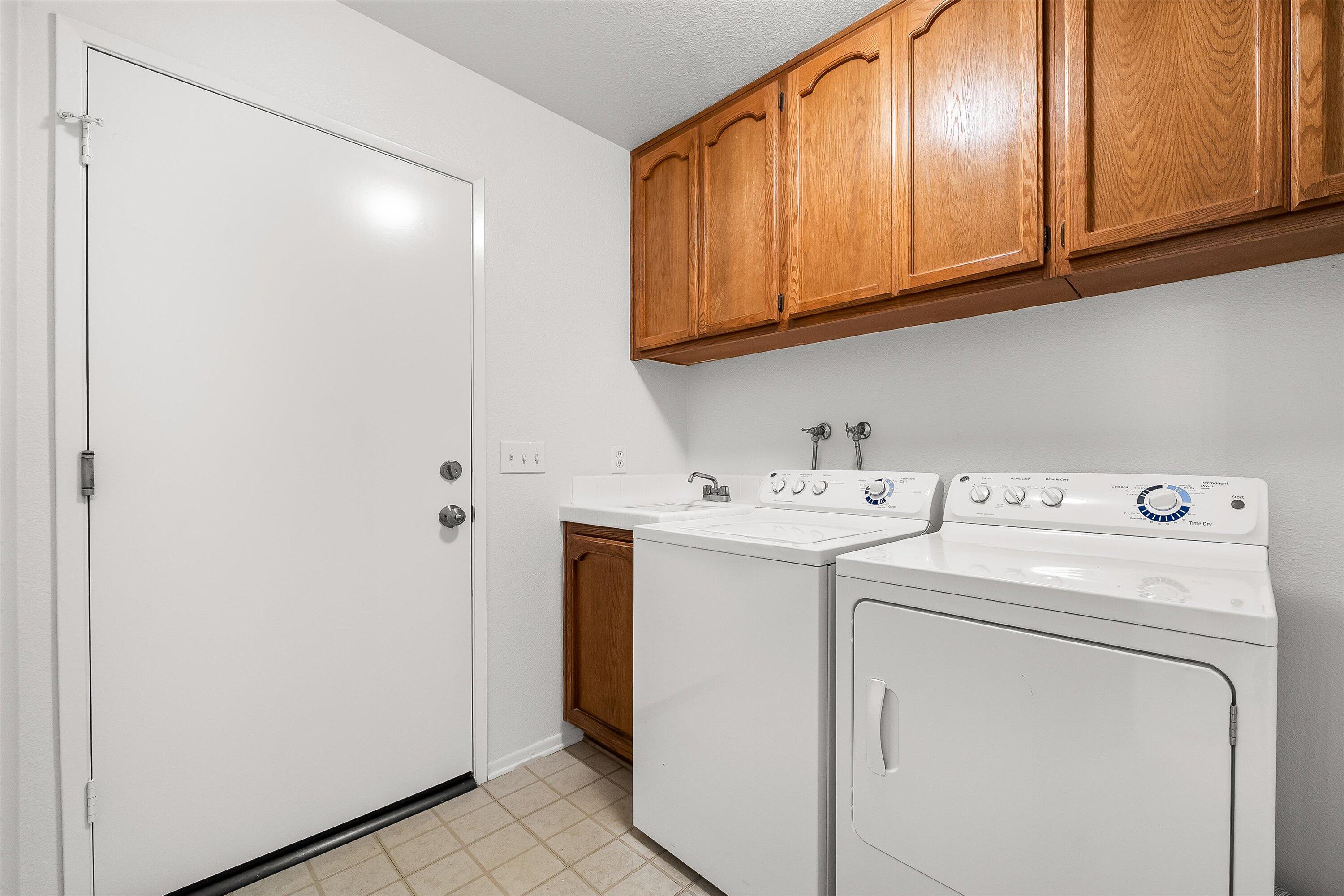 779 Dos Hermanos Road Santa Barbara, CA 93111 - Photo 22 of 33 a utility room with dryer and washer