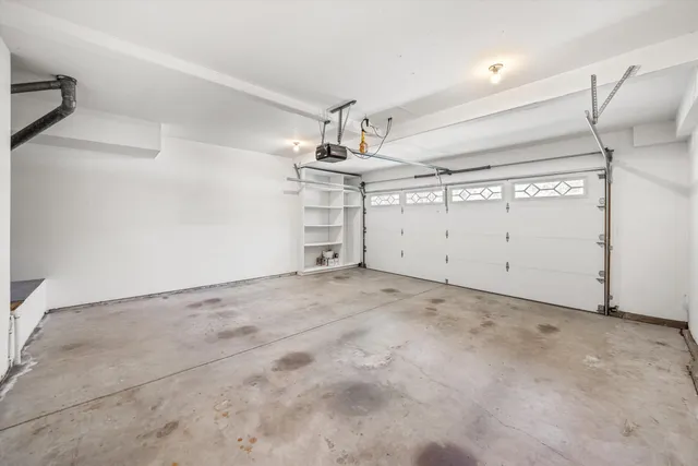 a view of a garden with a house