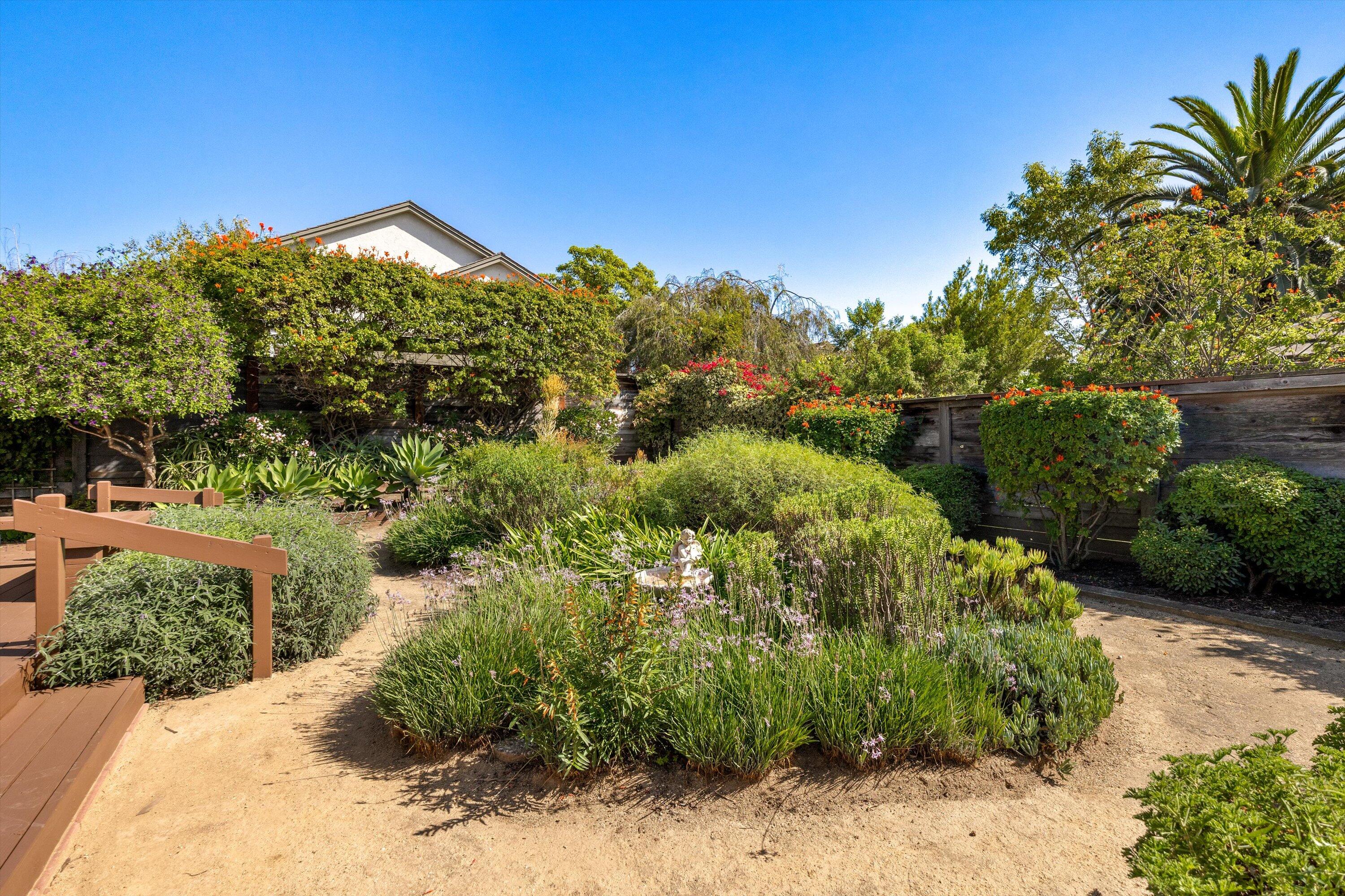 779 Dos Hermanos Road Santa Barbara, CA 93111 - Photo 24 of 33 a view of a garden with a house