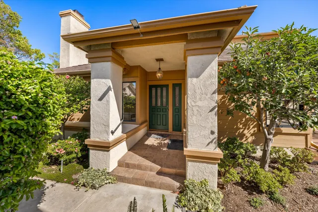 a view of a livingroom with furniture hardwood floor and a ceiling fan