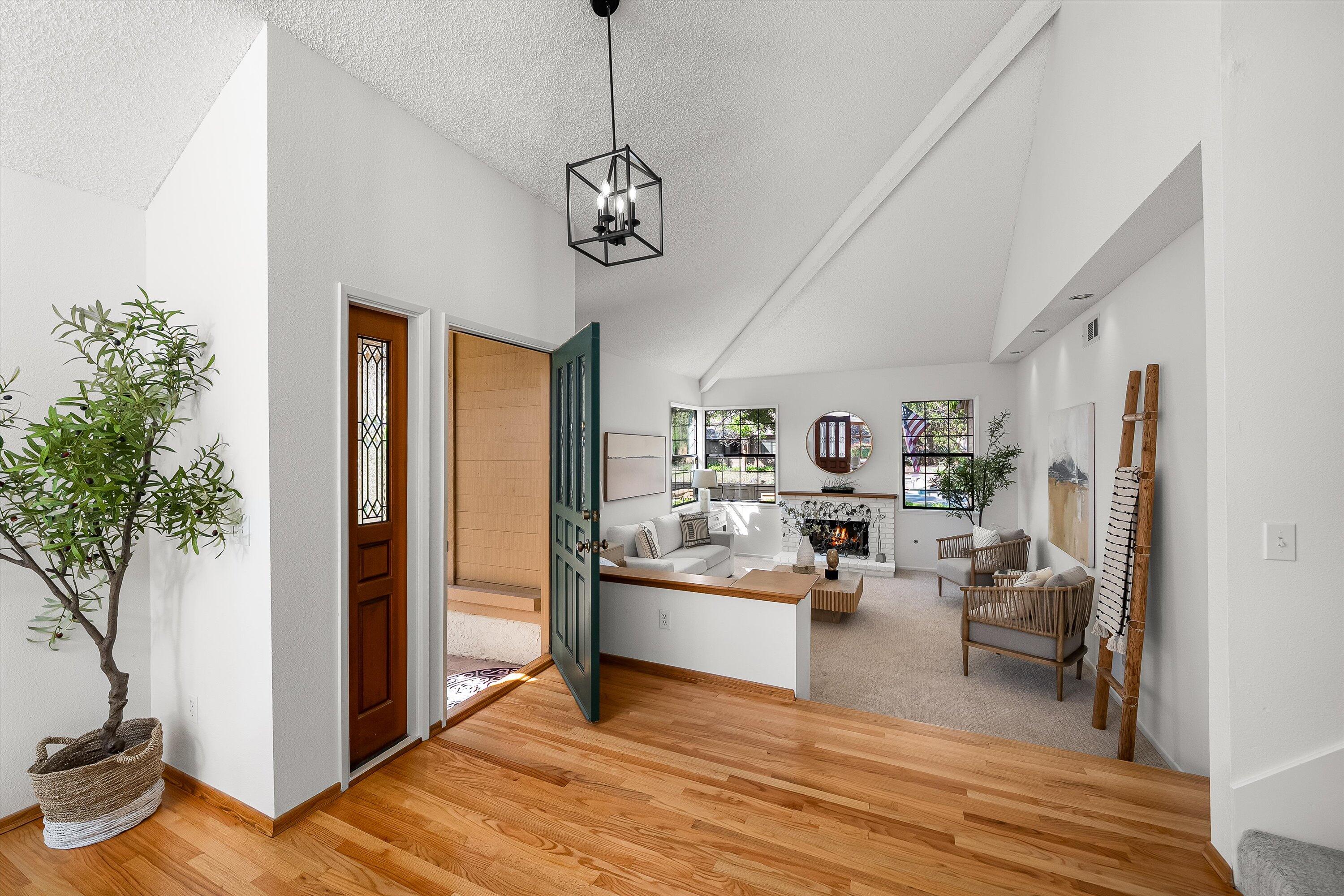 779 Dos Hermanos Road Santa Barbara, CA 93111 - Photo 4 of 33 a view of a livingroom with furniture hardwood floor and a ceiling fan