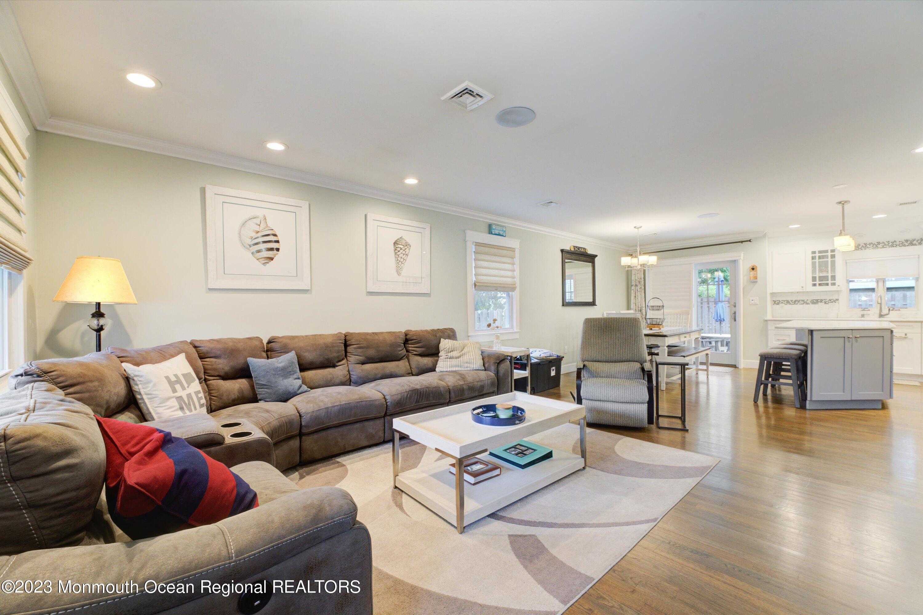 100 Manito Road Manasquan, NJ 08736 - Photo 5 of 28 a living room with furniture and a table