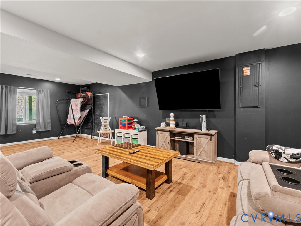 126 Reedy Creek Road Louisa, VA 23093 - Photo 28 of 68 This recreation room features wood-look flooring,
