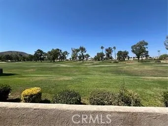 a view of a big yard with an outdoor space and seating area