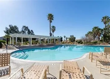 a view of a swimming pool with a patio