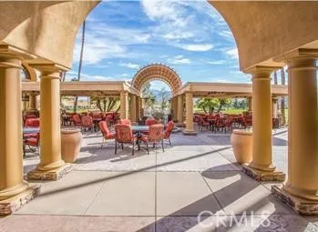 a view of swimming pool with outdoor seating